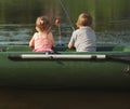 Happy boy swimming in fishing boat Royalty Free Stock Photo