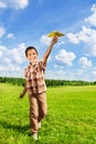 Happy boy throwing paper plane Royalty Free Stock Photo