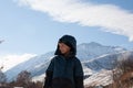 Happy boy walking in sunny mountains children`s clothing for the mountains close smiling portrait Royalty Free Stock Photo