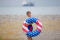 A happy boy wearing swimming goggles and an inflatable life buoy Royalty Free Stock Photo