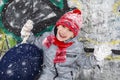 A child in winter with ice sleds