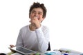 Happy boy writing on tablet while doing homework Royalty Free Stock Photo