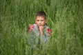 Happy boy young man on a green grain field Royalty Free Stock Photo