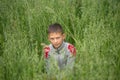 Happy boy young man on a green grain field Royalty Free Stock Photo