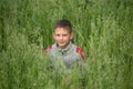 Happy boy young man on a green grain field Royalty Free Stock Photo