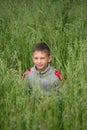 Happy boy young man on a green grain field Royalty Free Stock Photo