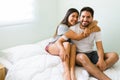 Happy boyfriend and girlfriend in the bedroom Royalty Free Stock Photo