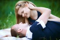 Happy boyfriend and girlfriend on plaid Royalty Free Stock Photo