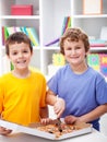 Happy boys cutting pizza Royalty Free Stock Photo