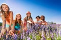 Happy boys and girls having fun in lavender field