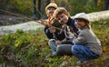 Happy boys go fishing on the river, children of the fisherman with a fishing rod on the shore of lake Royalty Free Stock Photo