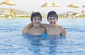 Happy boys have fun in the swimming pool Royalty Free Stock Photo