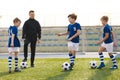 Happy Boys Talking with Junior Coach on Training Unit