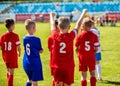 Happy Boys Winning Soccer Match. Young Successful Soccer Football team Royalty Free Stock Photo