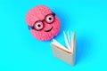 Happy Brain in Glasses is Reading with a Smile Royalty Free Stock Photo