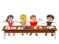 Happy brat kids children sitting desk school isolated Royalty Free Stock Photo