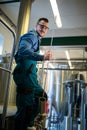 Happy Brewer holding working equipment Royalty Free Stock Photo
