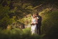 Happy bridal couple in park