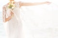 Happy bride with boquet on the beach Royalty Free Stock Photo