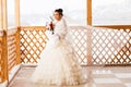 Happy Bride with bouquet waiting for groom in winter wedding day Royalty Free Stock Photo