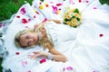 Happy bride on grass in park wedding Royalty Free Stock Photo