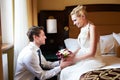 Happy bride and groom in bedroom