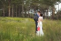 Happy bride and groom celebrating wedding day. Kissing married couple. Long family life concept