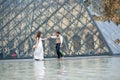 Happy bride and groom enjoying their wedding in Paris