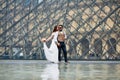 Happy bride and groom enjoying their wedding in Paris