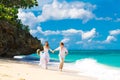 Happy bride and groom having fun on a tropical beach Royalty Free Stock Photo