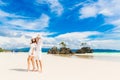 Happy Bride and Groom having fun on the tropical beach. Wedding Royalty Free Stock Photo