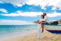 Happy bride and groom having fun on a tropical beach. Wedding an Royalty Free Stock Photo