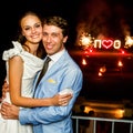 Happy bride and groom hugging smiling on background firework Royalty Free Stock Photo