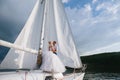 Happy bride and groom hugging on a yacht Royalty Free Stock Photo