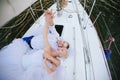 Happy bride and groom hugging on a yacht Royalty Free Stock Photo