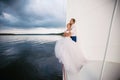 Happy bride and groom hugging on a yacht Royalty Free Stock Photo