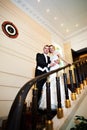 Happy bride and groom at luxurious stairs Royalty Free Stock Photo