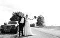 Happy bride and groom near car outdoors Royalty Free Stock Photo