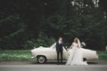 Happy bride and groom posing after wedding ceremony Royalty Free Stock Photo