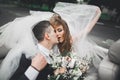 Happy bride and groom posing after wedding ceremony Royalty Free Stock Photo