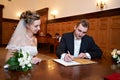 Happy bride and groom on solemn registration Royalty Free Stock Photo