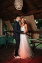 Happy bride and groom and their first dance, wedding in the elegant restaurant with a wonderful light and atmosphere Royalty Free Stock Photo