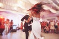 Happy bride and groom and their first dance, wedding in the elegant restaurant with a wonderful light and atmosphere Royalty Free Stock Photo