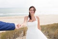 Happy bride and groom on their wedding hugging on the beach Royalty Free Stock Photo