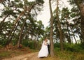 Happy bride and groom in the forest