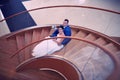 Happy bride and groom on their wedding stand on a wooden ladder Royalty Free Stock Photo