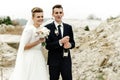 Happy bride and groom toasting with champagne, luxury wedding celebration, hilarious moment