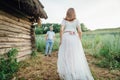 Happy Bride and groom walking on the green grass Royalty Free Stock Photo