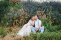 Happy Bride and groom walking on the green grass Royalty Free Stock Photo