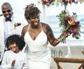 Happy bride and groom in a wedding ceremony at a tropical island Royalty Free Stock Photo